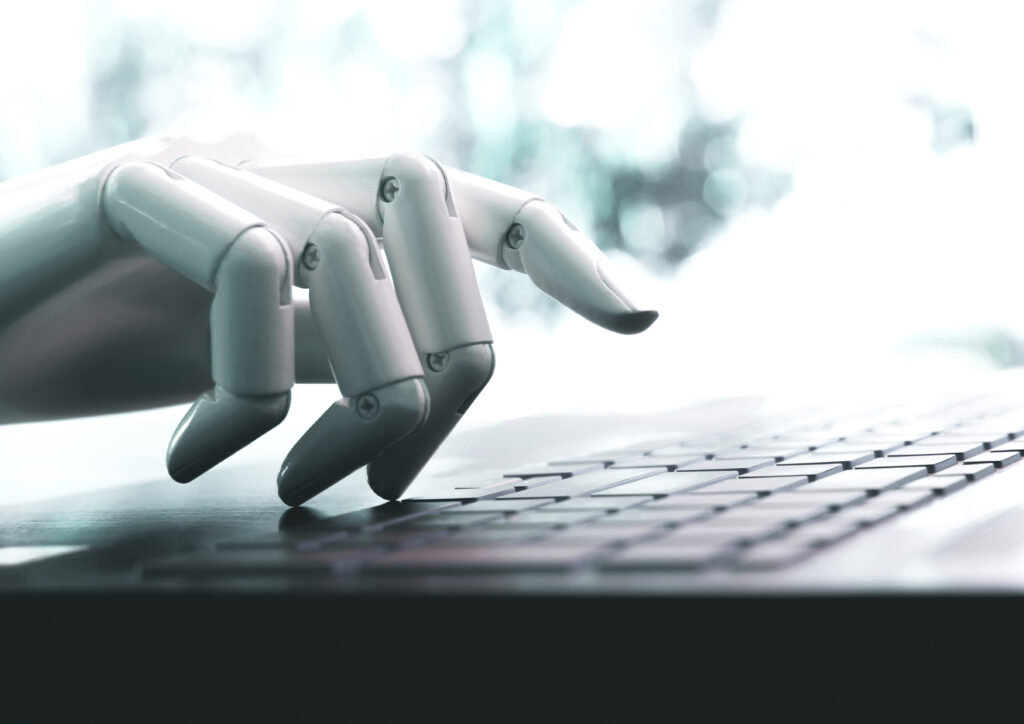 AI Leadership: Najvažnija kompetencija budućnosti 1 robot concept robot hand chatbot pressing computer keyboard enter